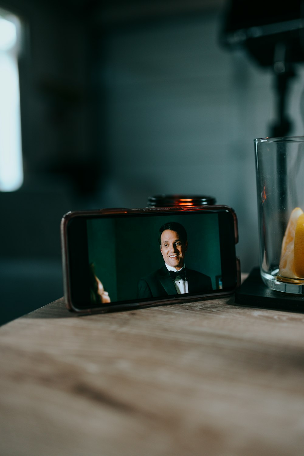 black and red smartphone on table