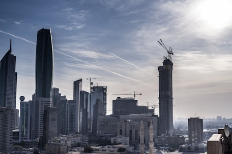 City skyline of Medellín showcasing construction cranes and urban development.