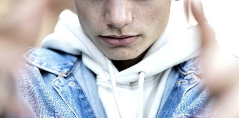 man in blue denim jacket