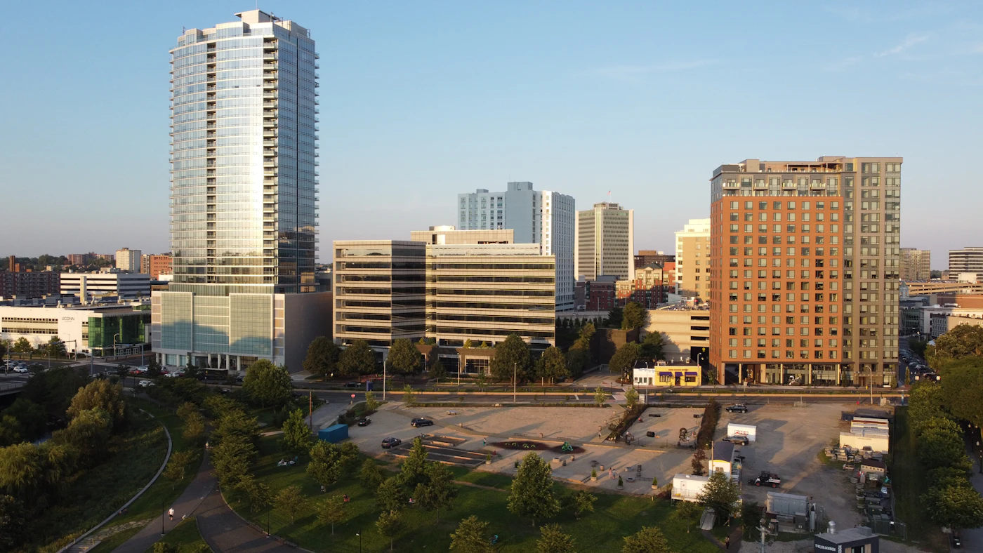 Office towers surrounded by trees on a clear day