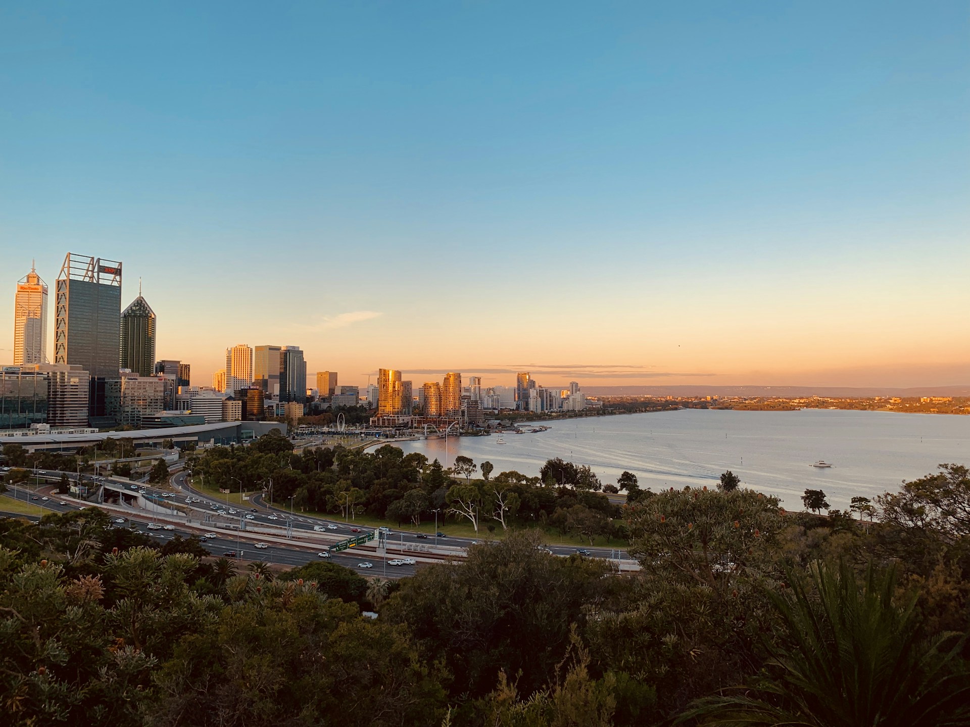 city skyline near sea during sunset