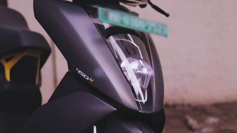 black and gray motorcycle in close up photography