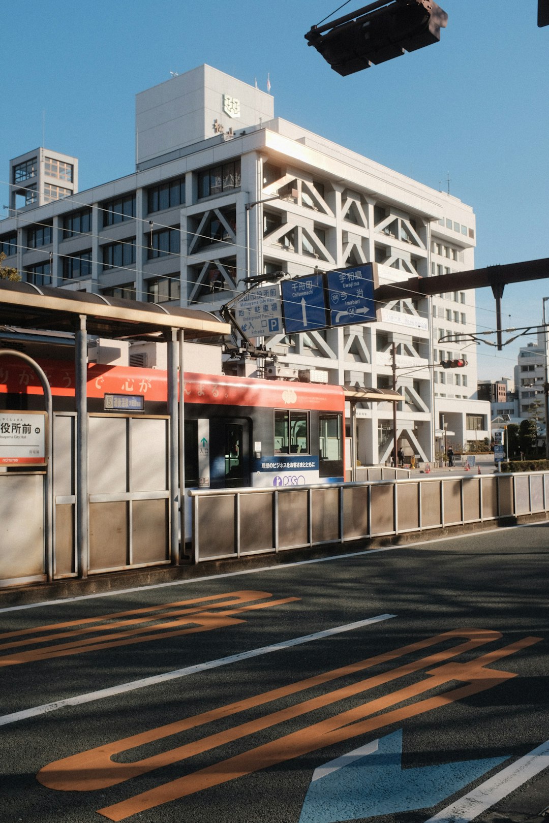 white and blue train on rail road during daytime