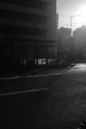 A cinematic still of a sunlit city street, capturing a quiet moment before the story unfolds.