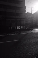 A high-resolution photo of a quiet urban street at dawn, showcasing soft natural light.