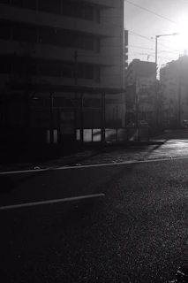A quiet street scene bathed in early morning glow, empty and serene.