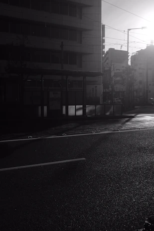 A high-resolution photo of a quiet urban street at dawn, showcasing soft natural light.