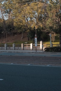View of the quiet green neighborhood near the veterinary school bus stop.