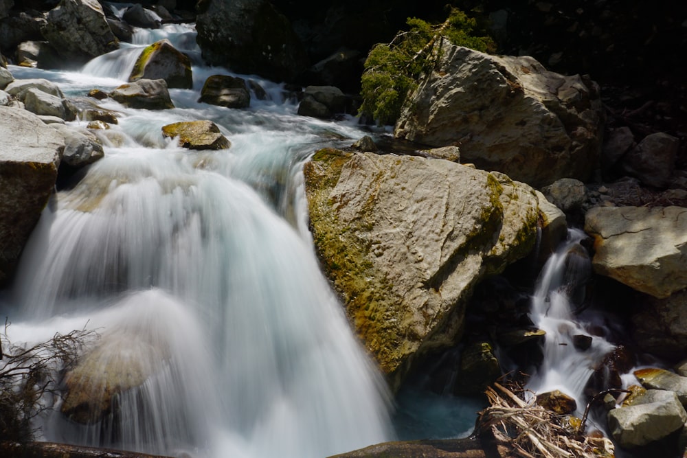 water falls on brown rocks