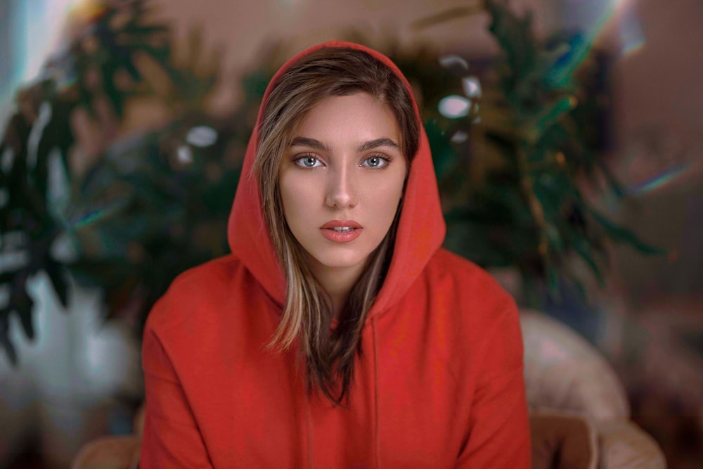 woman in red hoodie standing