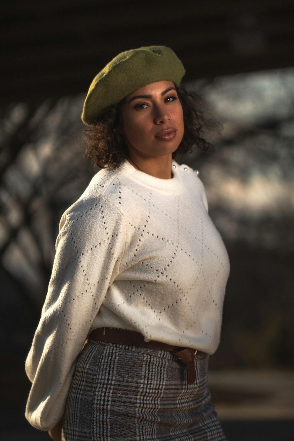 woman in white sweater and brown hat