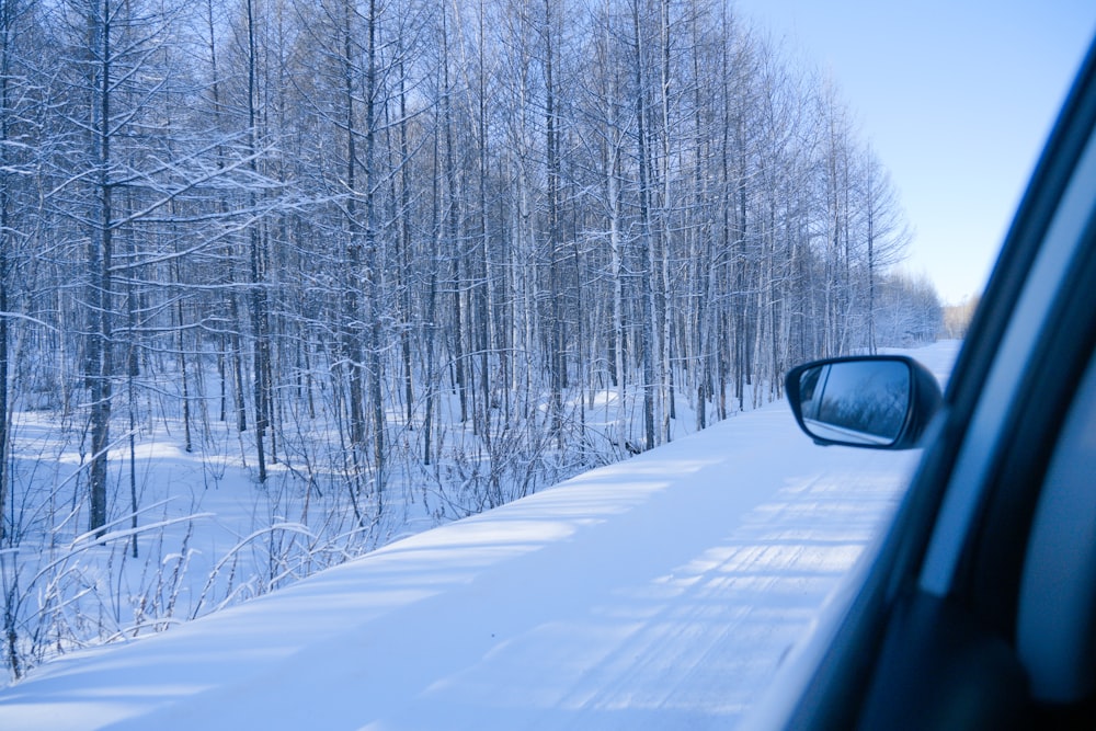 car on road covered with snow