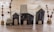 A collection of small, handcrafted wooden houses is arranged on a wooden surface. The houses vary in size, have dark walls with light-colored roofs, and feature painted windows and doors. Surrounding the houses are small decorative trees with brown branches and round bases.