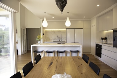 brown wooden table with chairs