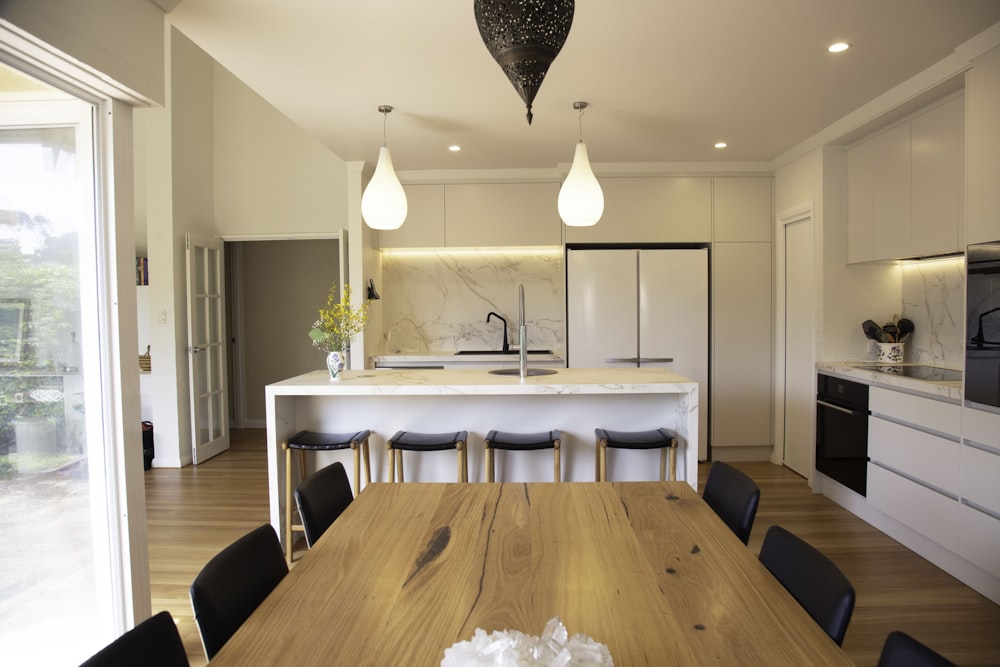 brown wooden table with chairs