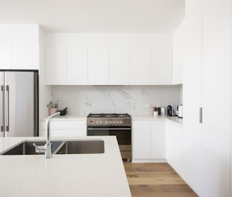 white wooden kitchen cabinet over white kitchen counter