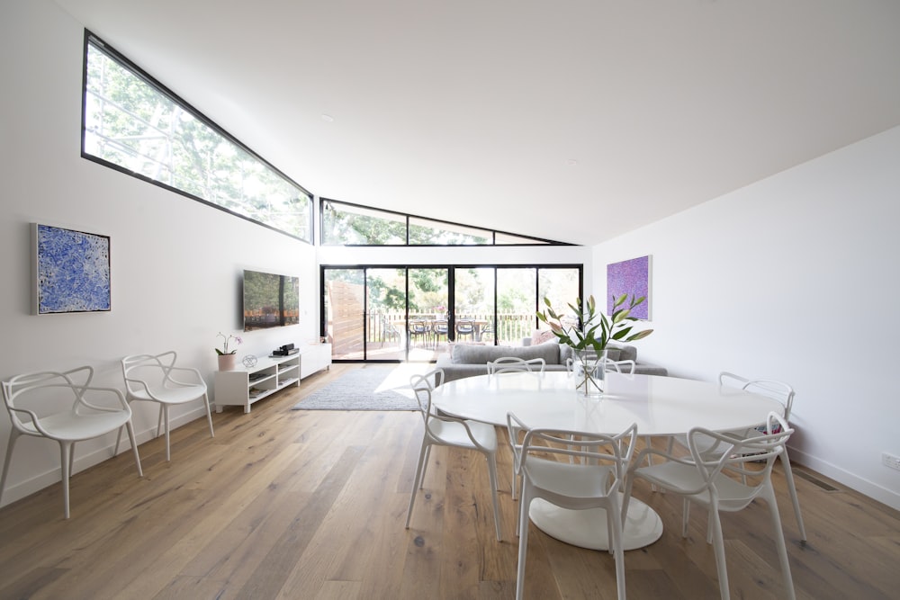 white and brown wooden table and chairs