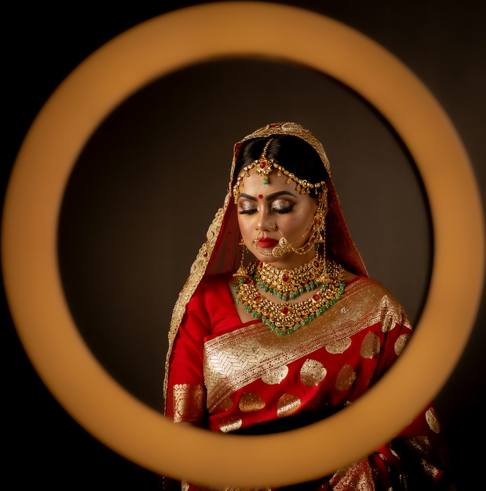 woman in red and gold dress