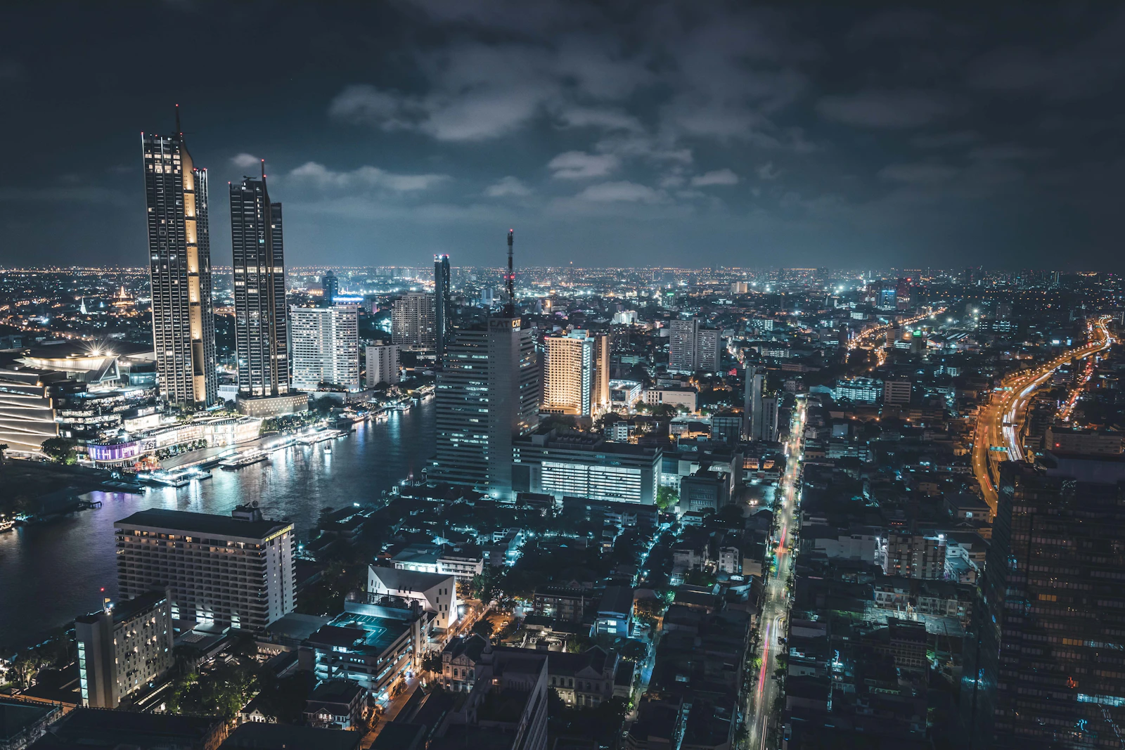 Bangkok city skyline at night seen from a rooftop