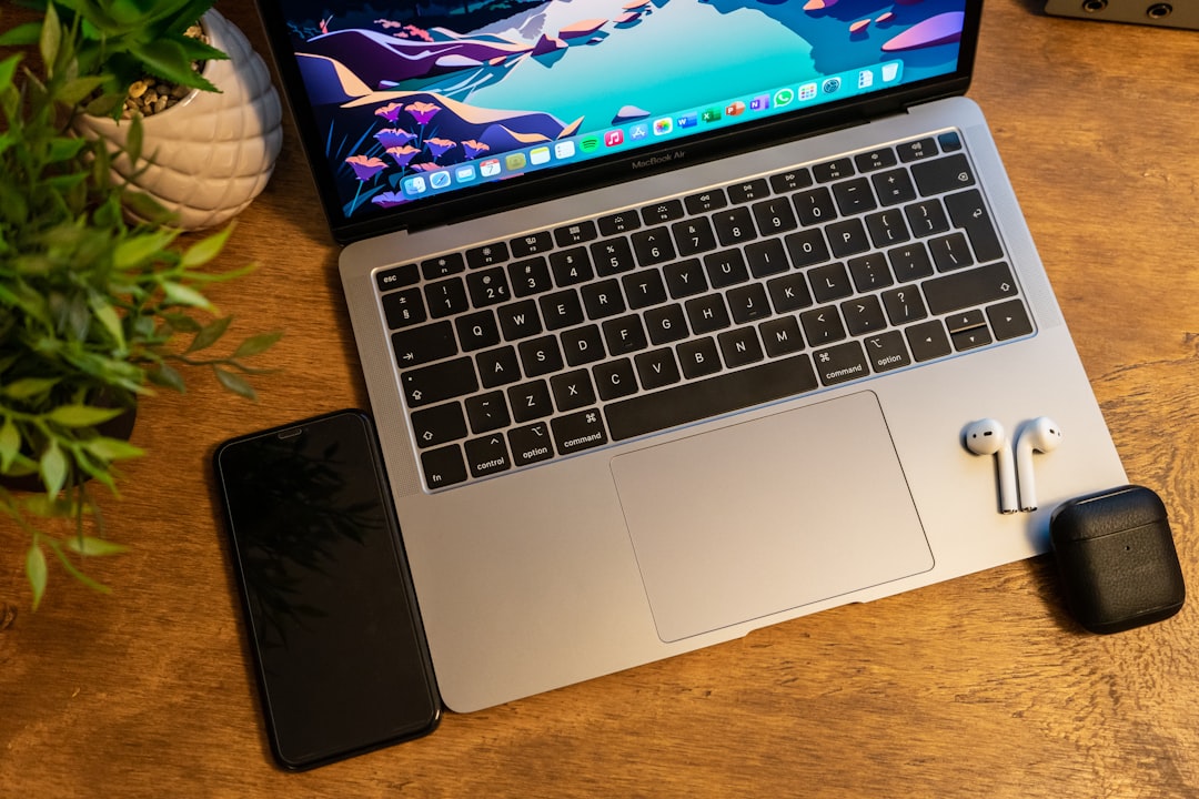 macbook pro on brown wooden table