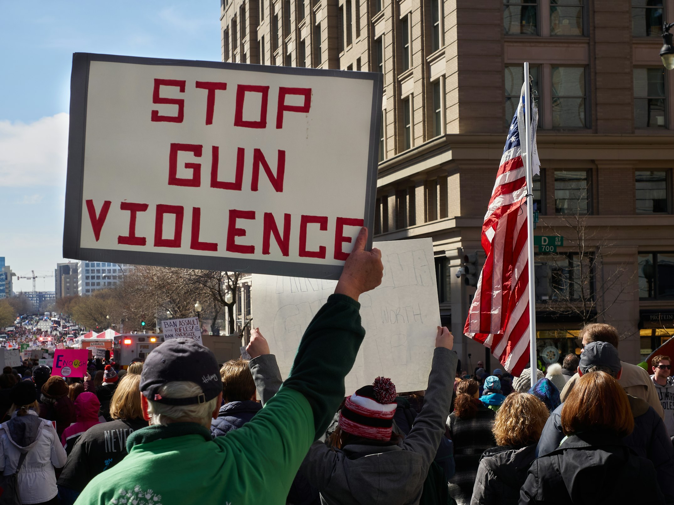 gun protest with signs