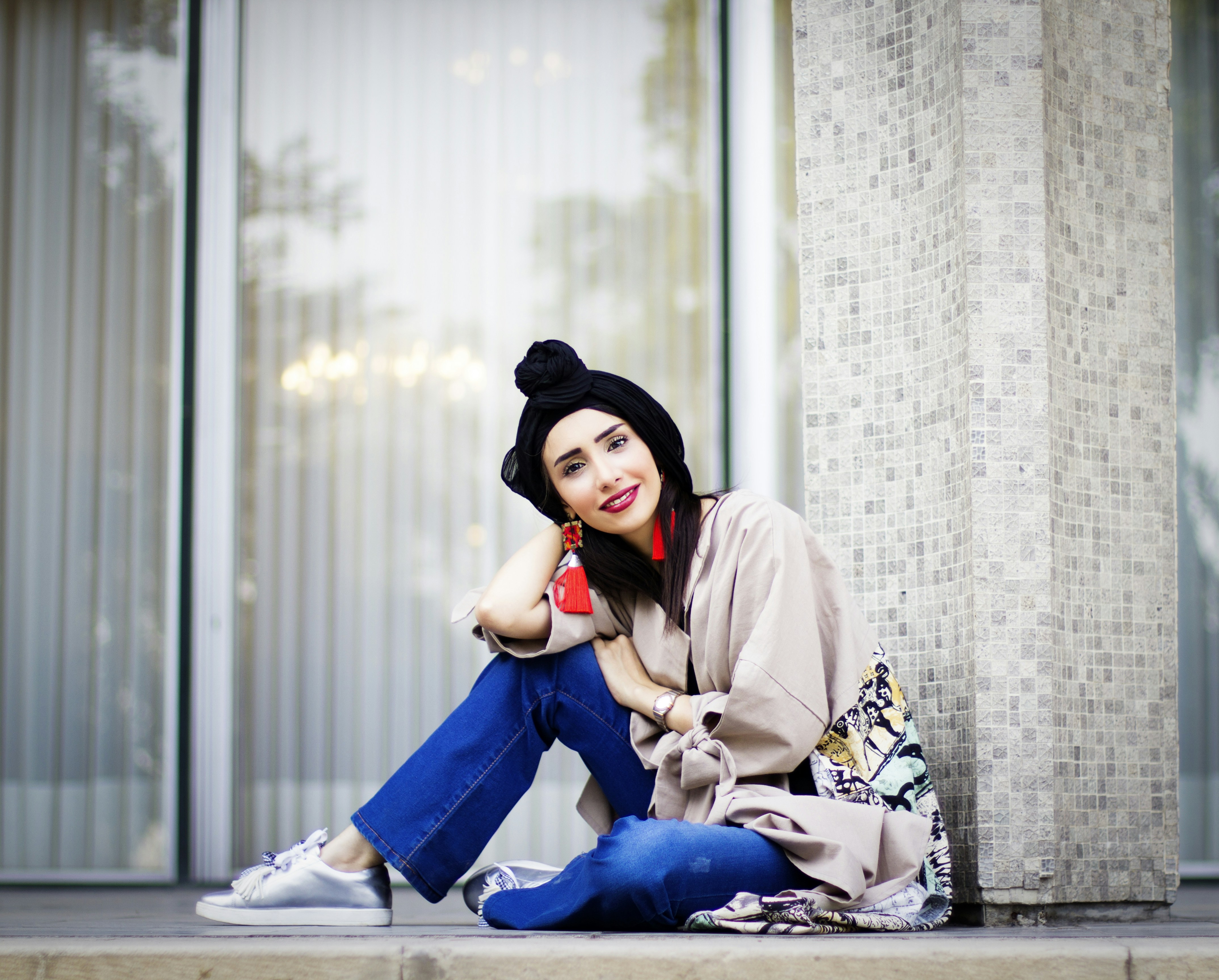 woman in blue pants sitting on floor