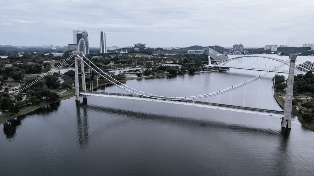 white bridge over body of water during daytime