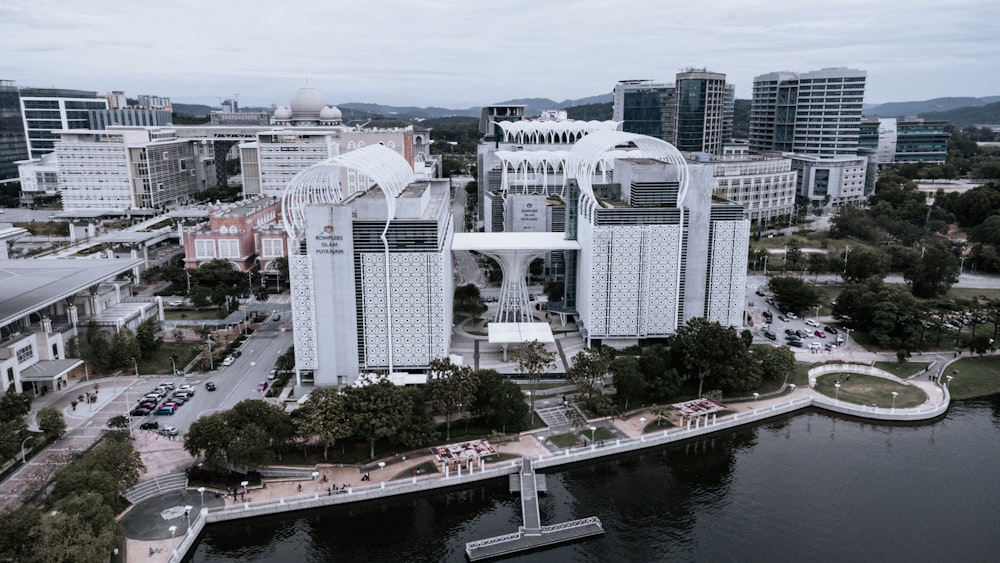 white concrete building near body of water during daytime