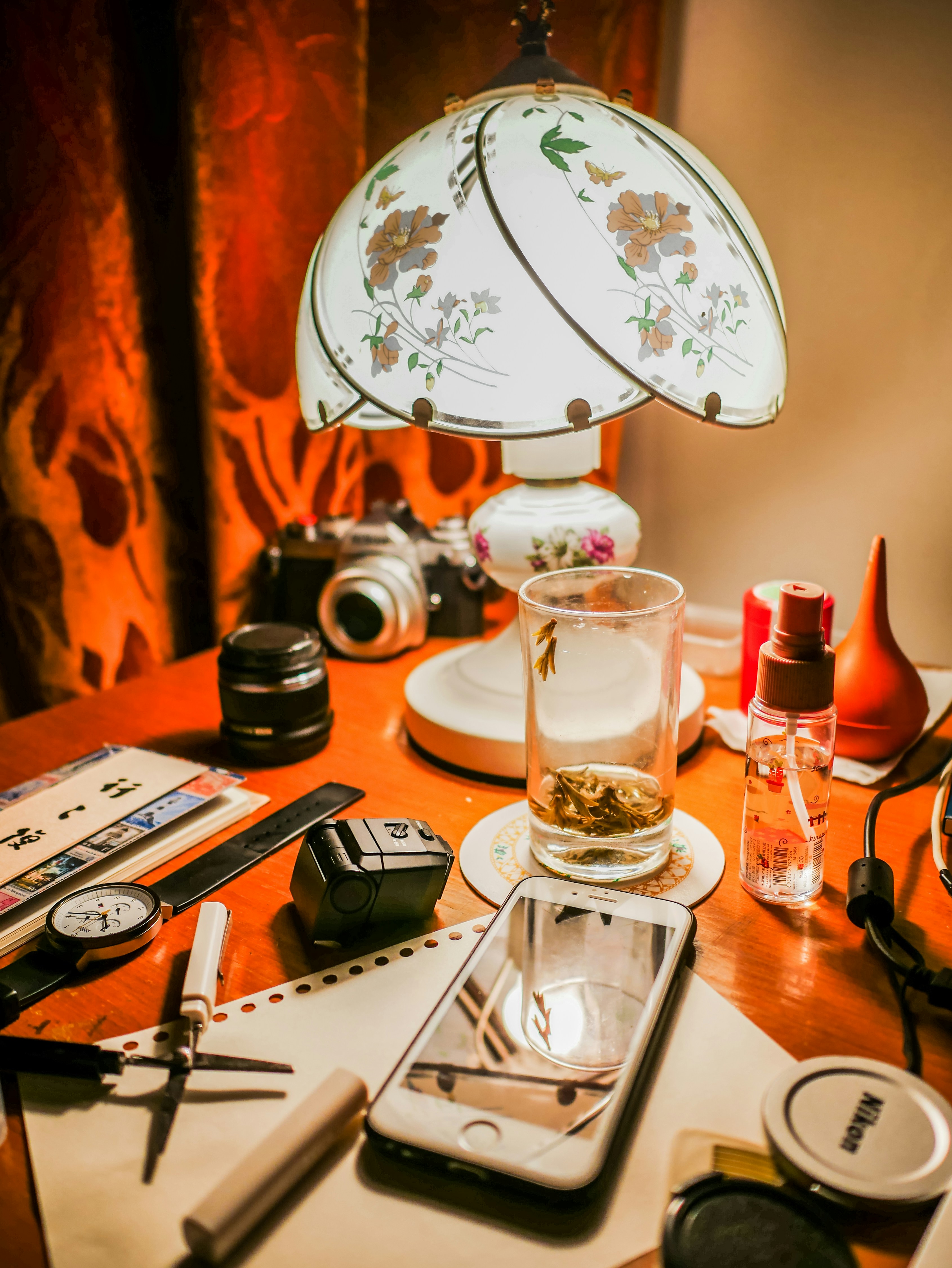 A cozy desk with scattered gift wrap, notes, and a warm cup of tea.