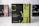 A product box with the label 'CRYSTALTEA' is prominently displayed in the center with a black and olive green design. The text includes 'Elixir Slim AMAZZONITE' along with a note about '10 pyramidal filters'. The background features a blurred image of similar product boxes.