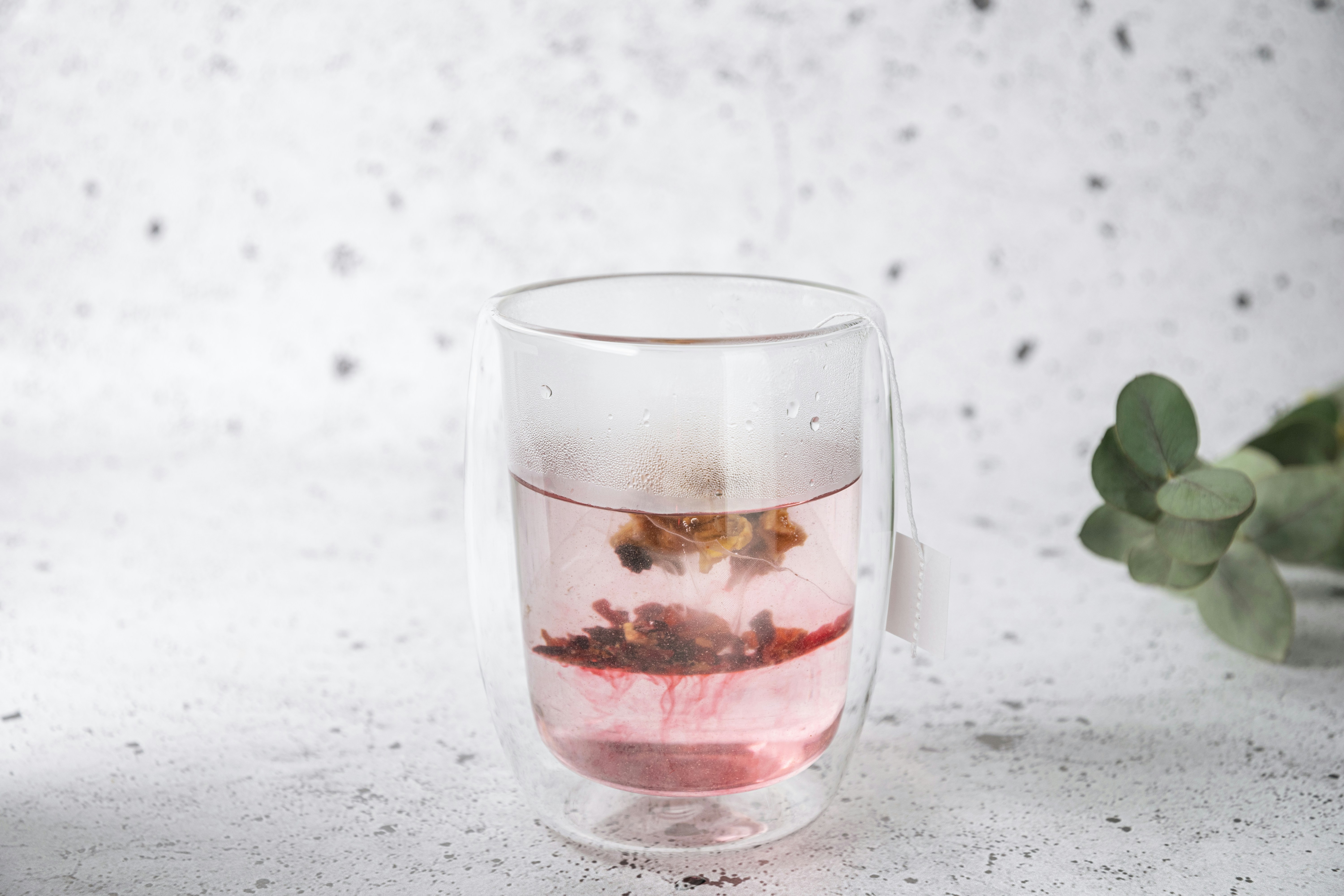 Hibiscus Tea In A Glass With Ice And A Slice Of Lemon