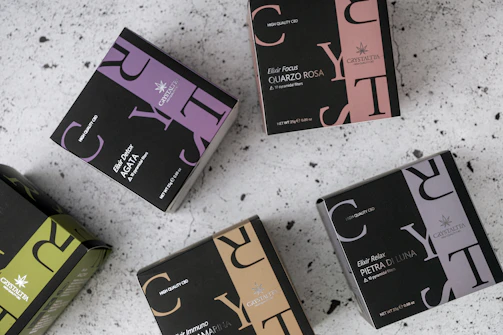 A collection of health supplements and teas with colorful labels on a bright background.