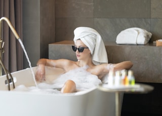 woman in white bath tub