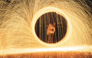 User celebrating a win with vibrant violet light trails swirling around