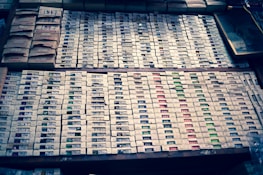 Stack of software boxes representing different categories like education and accounting.