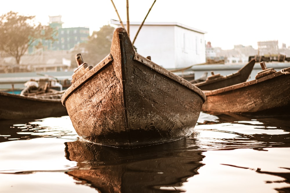 brown canoe on water during daytime