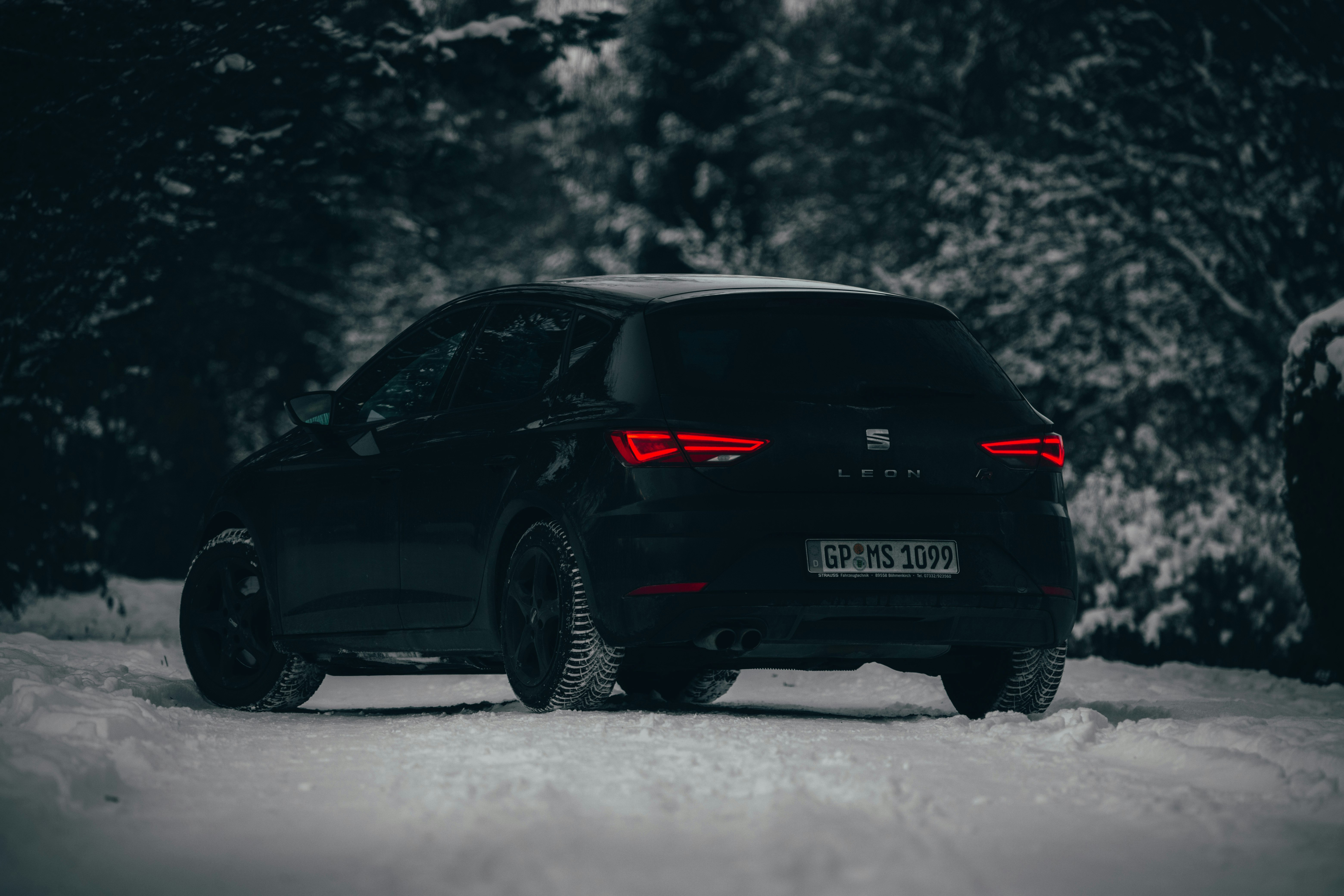 black car on snow covered ground