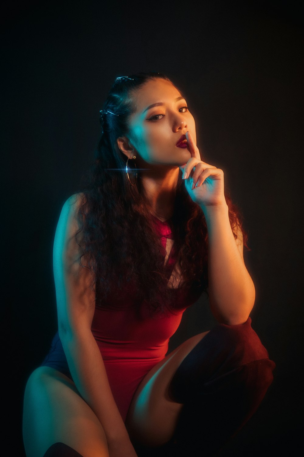 woman in red tank top smoking cigarette