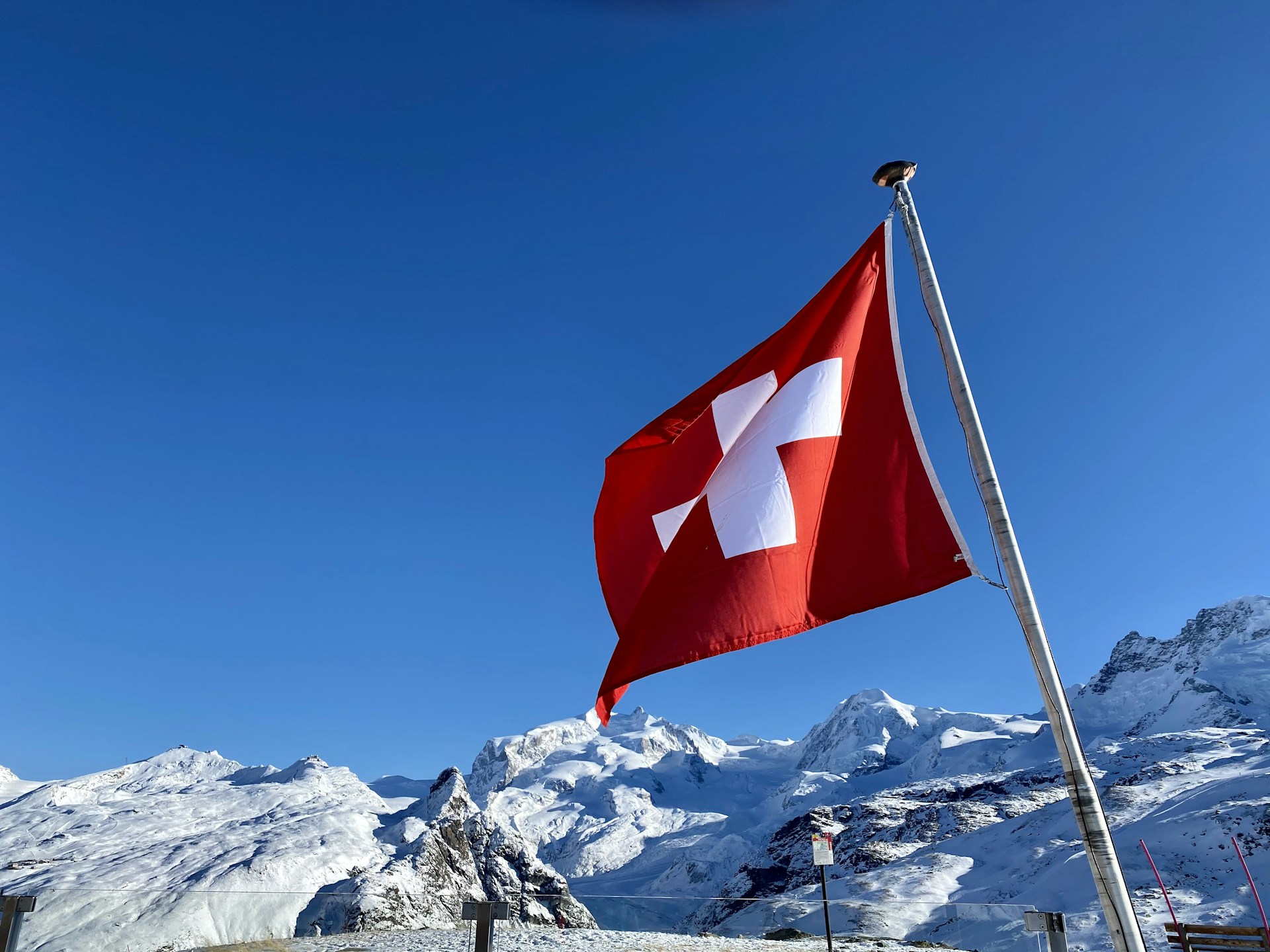 red and white flag on pole