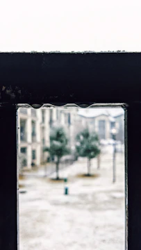 A moody black and white frame from a psychological thriller.