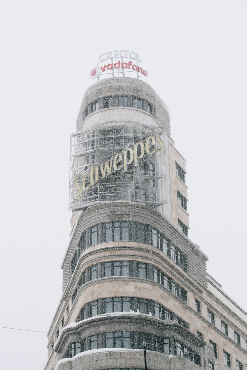 white concrete building under white sky during daytime