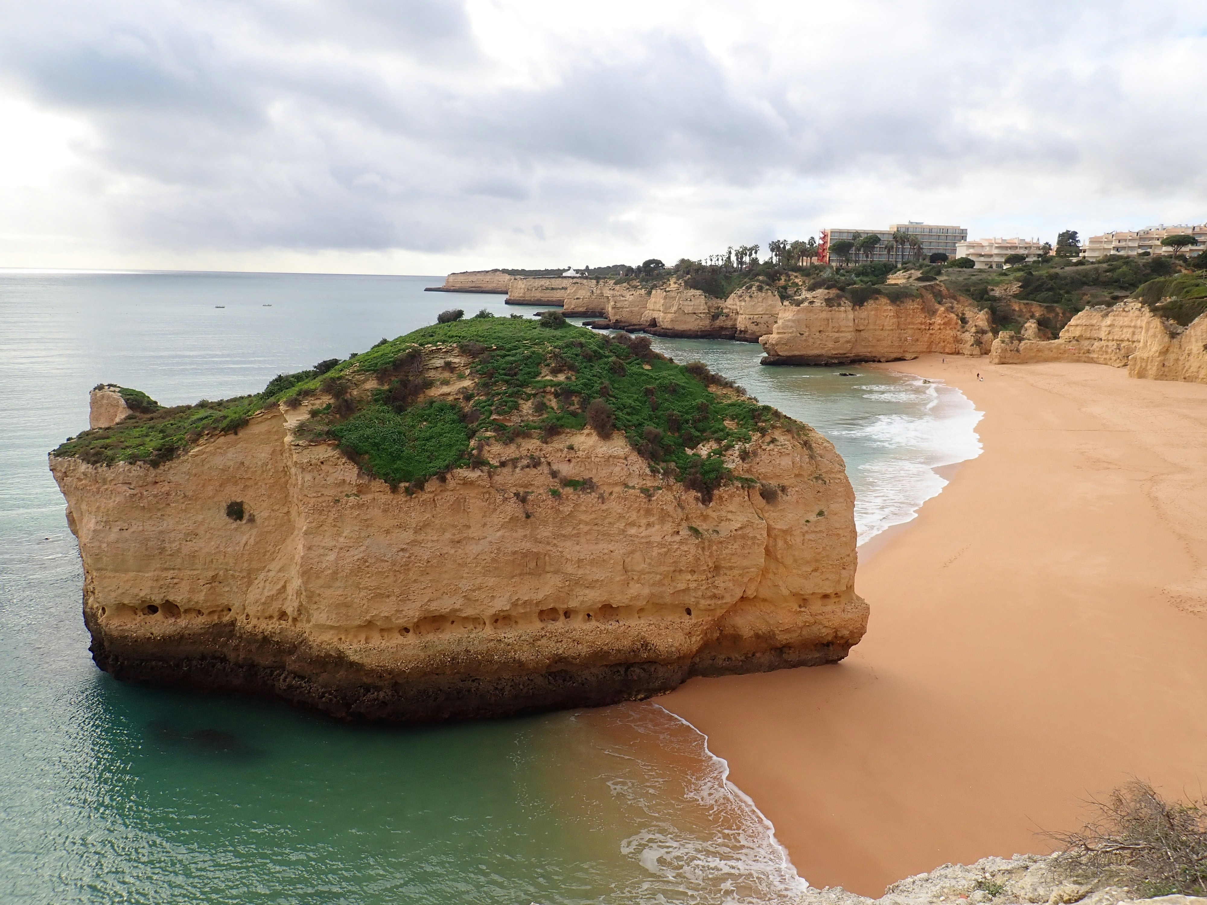 brown rock formation on sea shore during daytime