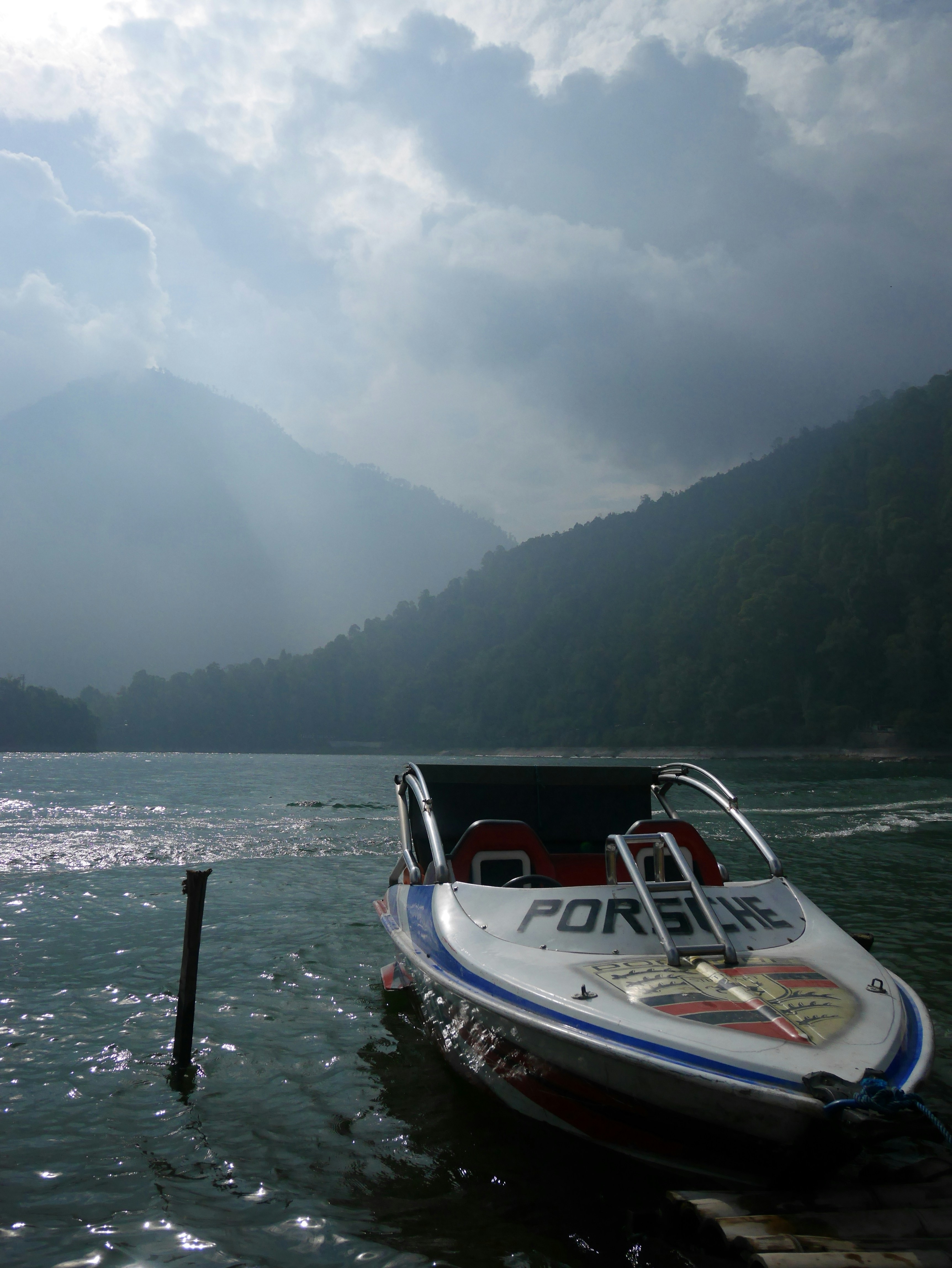 white and red boat on water during daytime