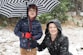 girl in black and white polka dot hoodie holding umbrella
