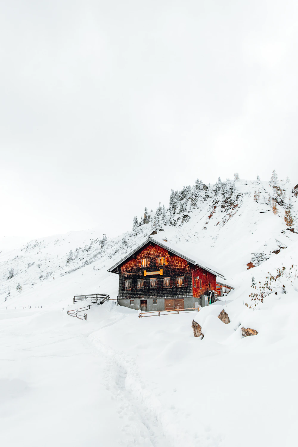 Wooden house on snow