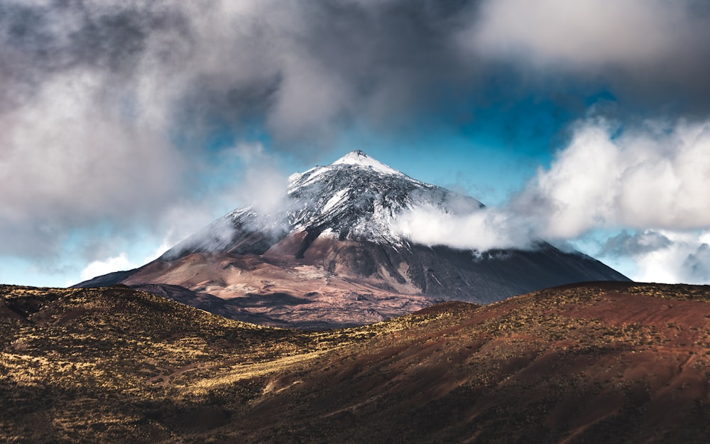 brown and white mountain under blue sky during daytime