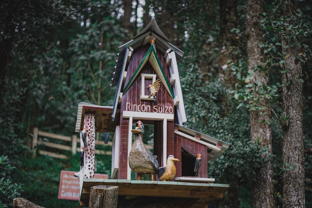 brown wooden house with brown bear figurine