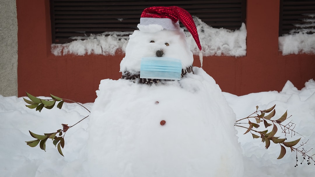 snowman with red ribbon on top