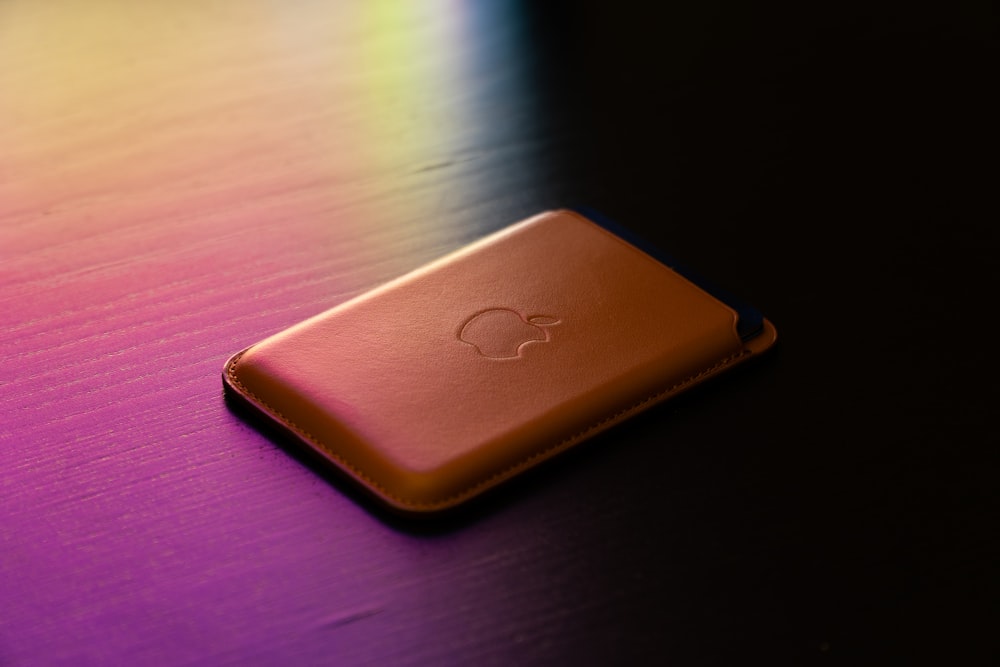 gold apple tv on brown wooden table