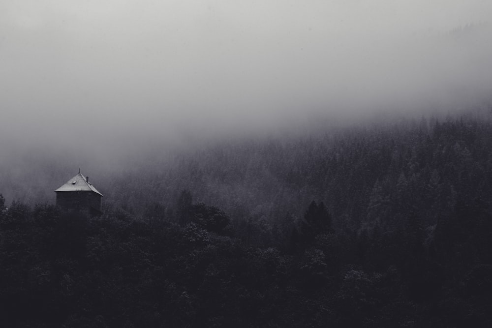 black and white house on top of mountain